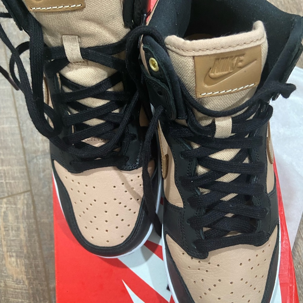 Size 7 women Nike high tops black and beige.  Brand new never worn.